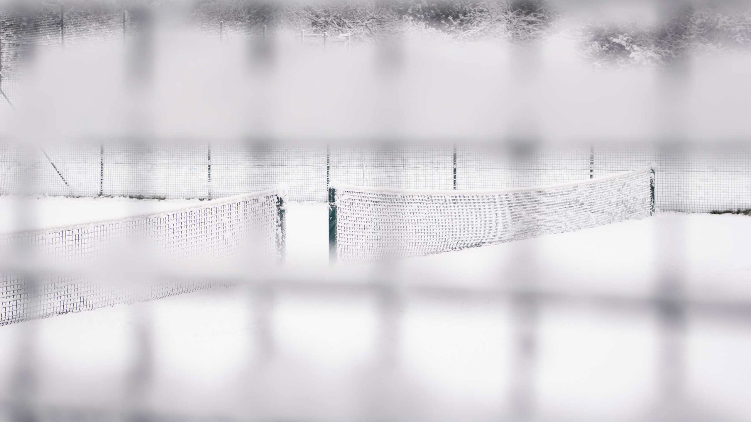 Snow-covered tennis court in Waterlow Park, Islington, London, UK.